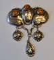 Danish Art 
Nouveau pendant 
in silver with 
amber, 20th 
century. 
Decoration in 
the form of ...