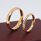 Set of wedding 
rings in 18k 
gold. One with 
a blank 
surface, in 
ring size 61 
(size can be 
...