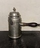 Coffee pot made 
In Pewter With 
lid and wooden 
handle. 
Engraved 
decoration on 
the front 
showing ...