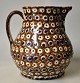 Antique Danish 
clay jug, 19th 
century. Red 
clay with 
brown, blue and 
green glazes. 
H.: 18 cm.