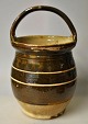 Antique Danish 
maternity pot 
in red clay, 
19th century. 
Brown glazed 
with white 
stripes. H.: 26 
cm.