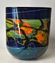 Nemtoi, Ioan 
(1964 - ) 
Rumænien: 
Glasvase i 
trekantet form. 
Glas i blå og 
grøn med gule, 
orange ...