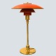Poul Henningsen; PH 3/2 table lamp, with red lacquered shade Poul Henningsen; PH 3/2 table lamp, with red lacquered shade