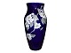 Tall dark blue 
Royal 
Copenhagen vase 
with apple 
blossom.
The item is in 
our remote 
warehouse. ...