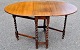 English gateleg 
table in oak 
wood, 19th 
century.