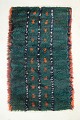 Scandinavian 
designer
Rya carpet, 
1960/70s.
Hand-knotted 
rya carpet in 
wool featuring 
vertical ...