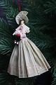 Old Christmas 
tree ornament, 
nice lady 
holding a small 
Santa Claus 
doll, made of 
colored crepe 
...