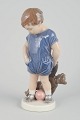 Royal 
Copenhagen
Figurine “Boy 
with Teddy 
Bear”, model 
3468, 1920s.
Porcelain 
figurine of a 
...