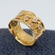 Henning 
Skovgaard; Wide 
ring in 14k 
gold, set with 
four diamonds, 
total 0.20 ct. 
Ring size 53. 
...