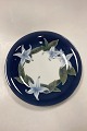 Royal 
Copenhagen Dish 
No. 1063/646. 
Motif with 
lilies on a 
dark blue 
background. 
Measures 35.5 
...