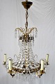 Prism chandelier, 20th century. In brass with decorations of leaves and garlands. For 5 electric ...