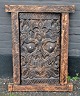 African wooden door with carvings. With bolt on the back. H: 71.5 cm. W: 53 cm.