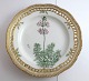 Royal 
Copenhagen. 
Flora Danica 
plate w. 
open-work 
border. 
Diameter 25 cm. 
Model 3553. (1 
...