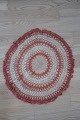 An old table 
centre /mat 
Round
Made by ...