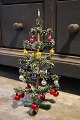 Antique 
miniature 
Christmas tree, 
made of colored 
paper and 
decorated with 
lots of small 
colored ...