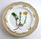 Royal 
Copenhagen 
Flora Danica. 
Lunch plate 
with open-work 
border. Design 
# 3554. 
Diameter 23 cm. 
...