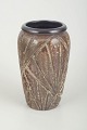 Ingrid 
Atterberg for 
Upsala-Ekeby
Vase, 1960s.
Relief-
decorated 
stoneware vase 
with pronounced 
...