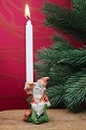 Small biscuit 
gnome with a 
nice patina 
that holds a 
small Christmas 
candle. Height: 
7.5cm.