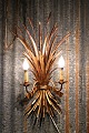 Large gilded 
Hans Kögl metal 
wall lamp
in Hollywood 
...