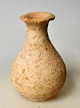 Antique Roman 
perfume jar. 
Soil find. Red 
clay. Height: 
9.5 cm.
With minor 
chips on the 
edge!