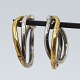 Anette Kræn; A 
pair of ear 
rings in silver 
and gilded 
silver.
Ear rings for 
hanging inside 
the ...