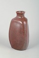 L. Hjorth, Denmark.Triangular Vase, Mid 20th Century.Handmade stoneware vase with a softly ...