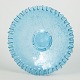 Decorative pressed glass dish in light blue with a ruffled edge and embossed floral and vine ...