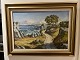 The painting is a landscape motif framed in a gold frame and depicts a stretch of coastline with ...