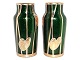 Two small green 
Art Nouveau 
glass vases 
with gold 
decorations 
from around 
1900 to ...