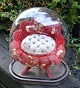French glass dome centerpiece, c. 1870. Globe de mariée. Inside with chair in red plush and silk ...