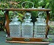 English 
tantalus with 
three crystal 
decanters, 19th 
century.