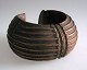 African bangle, 19th century. In copper. Decorated with geometric pattern. Dia.: 12 cm.
