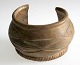 African bangle, 19th century. Bronze. With decorations. H .: 6.5 cm. Dia .: 11 cm.