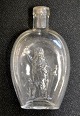 German flask in clear glass with motif of Germania, 19th century. Embossed on the bottom with ...