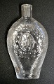 Swedish flask in clear glass with grooves, 1872-1907. Embossed with Oscar II of Sweden's ...