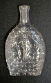 German pocket flask with a motif of a miner, 19th century. Clear glass. Nubbed glass. Embossed ...