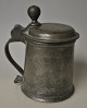 Pewter mug 1763, Germany. Conical with handle and spout. Stamped in lid. H.: 16 cm. Engravings ...