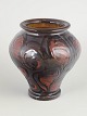 Kähler vase, 1930s.Thrown stoneware vase with a rounded body and defined foot. The surface is ...