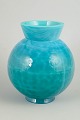 Eva Englund for Pukeberg, art glass vase.Globular vase in turquoise art glass with lively ...