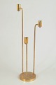 Jarl Näs, three-armed candlestick.Sculptural three-armed candlestick in solid brass with ...