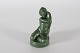 Ipsens EnkeFigurine of a sitting boywith jade green glaze no. 862Designed by Axel ...
