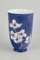 Royal Copenhagen, vase.Tall cylindrical porcelain vase with a deep cobalt blue ground and a ...