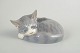 Royal Copenhagen, sleeping cat figurine.Porcelain figurine depicting a curled, sleeping cat, ...