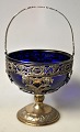 Large silver sugar bowl with cobalt blue glass insert, 19th century. Later decorated with ...
