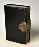 Psalm book in black leather binding and silver mounting, 1854. Silver mounting with the lamb and ...