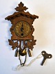Miniature Schwartzwald clock, 19th century. H.: 13 cm.