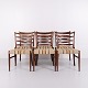 N.O. Møller dining chairs in rosewood with striped upholstery from the 1960s. Designed by J.L. ...