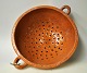 Colander in glazed earthenware, 19th century. Denmark. Reddish-brown glaze. Diameter: 24 cm.