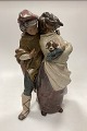 Lladro Stoneware Figurine of Girl and Boy with Dog - Facing the Wind. Designed by Juan Huerta, ...