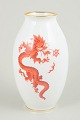 Vase with Ming dragon, Meissen area.Baluster-shaped vase in white-glazed porcelain decorated ...